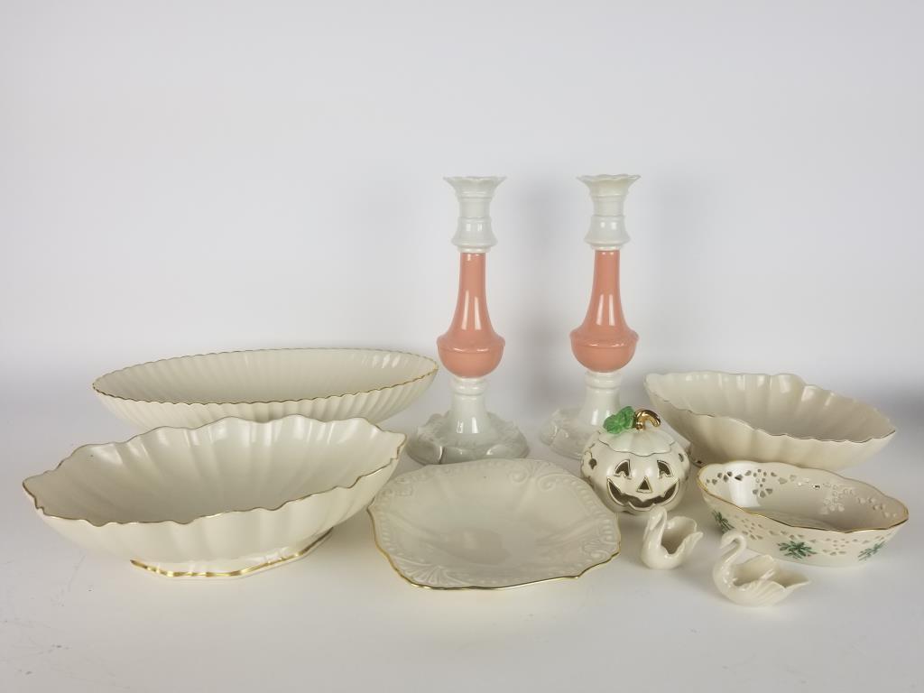 Large lot of Lenox china: large console bowl measures 13 inches long. 2 med sized bowls(one is a Telafloral bowl), 11 inch tall candle holders, pierced Christmas dish, pierced pumpkin dish and 3 more pieces. Total of 9 Lenox p