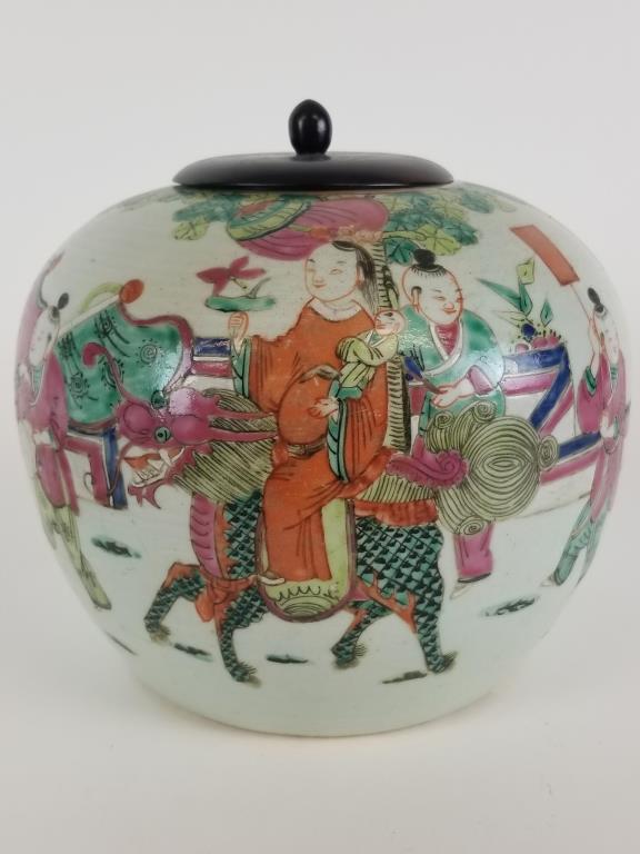 Chinese Ginger jar with colorful scene: Chinese pottery ginger jar with colorful parade scene. Later wooden lid with Shanghai paper tag. Measures 7.5 inches tall.
