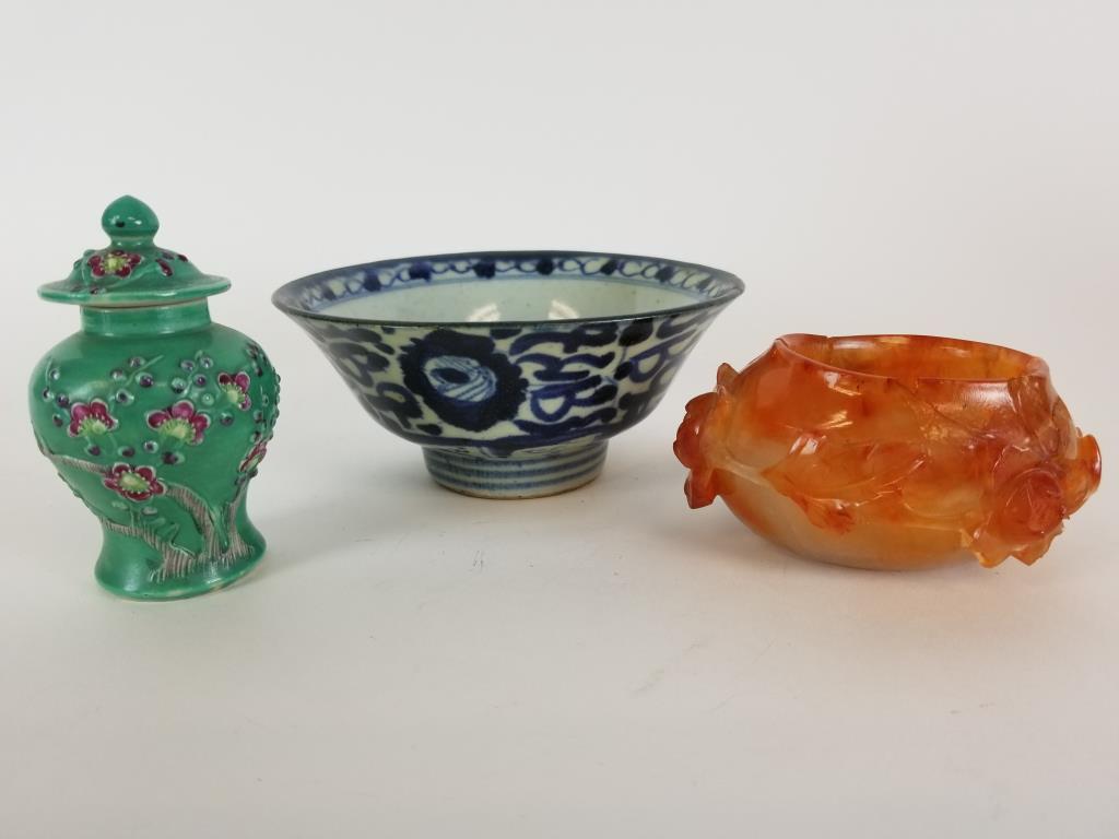 Lot of 3 Asian decorative lot: Blue and white glaze bowl, measures 5.5 inches in diameter. Small pottery ginger jar with lid, marked China on the bottom. Carved flower stone bowl has cracks, likely to have been glued.
