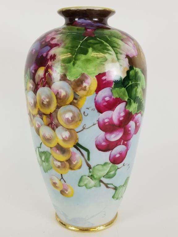 Nippon hand painted porcelain vase: Marked hand painted Japan Nippon. Measures 11 inches tall.