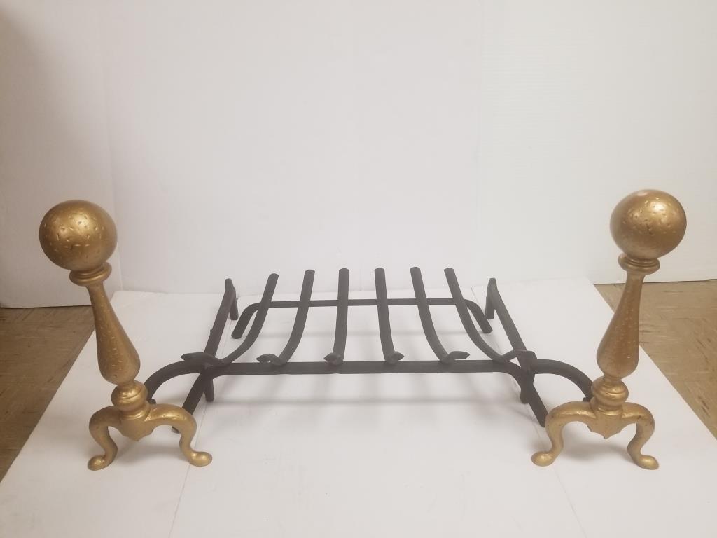 Cast iron fireplace andirons with log rack: Gold cast iron andirons. Each measures 19 inches tall x 19 inches long. With a cast iron fireplace log rack.
