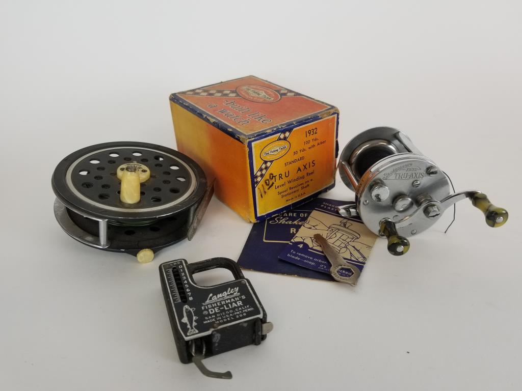 Pflueger and Shakespeare fishing reels: Pflueger Medalist fly fishing reel. Shakespeare 1932 Tru-Axis bait casting reel, in box with key and papers. Vintage cast Langley De-liar scale.