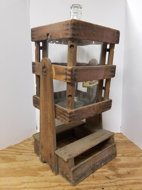 Wilkes Barre PA water bottle tilting crate: Spring on Nescopeck Mountain, PA, Wilkes Barre, PA. Glass water bottle, in a wooden tilting crate. Measures 30 inches tall, including the bottle.