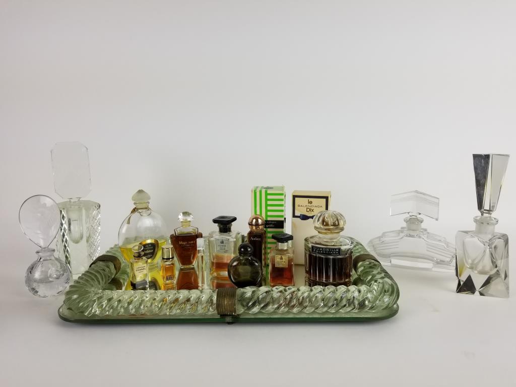Vintage vanity tray, with perfume and bottles: Vintage mirror vanity tray, with twisted glass edg, measures 16 inches x 10 inches. 4 lead crystal perfume bottles, tallest one measures 8 inches tall and has a chip. Various perfumes, including 2 Bal