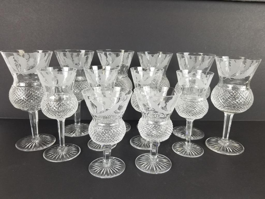 Lot of 12 Edinburgh Crystal Thistle glasses: Edinburgh Crystal wine/water glasses in Thistle pattern. Six 7 inch glasses, four 6 inch glasses and two 5 inch glasses.