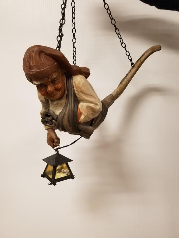 German Wine Cellar Keeper hanging lamp: Carved wood man holding lantern with horn legs. Measures approx. 20 inches long.