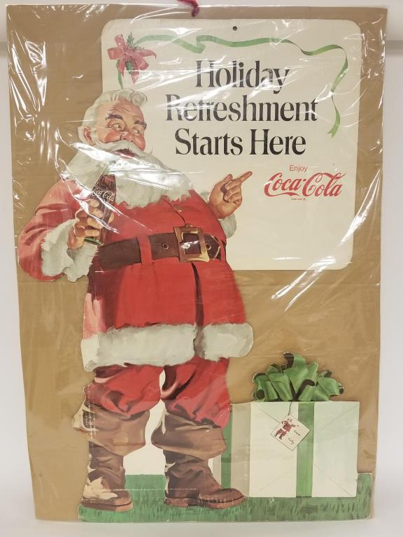 Vintage Coca Cola Santa store display: Coca Cola Santa cut out cardboard display sign. Measures 32 inches tall x 22 inches wide. Sealed in cellophane, unsure if it has an easel or if it is just one sided or two. 5 inch tear in his left boo