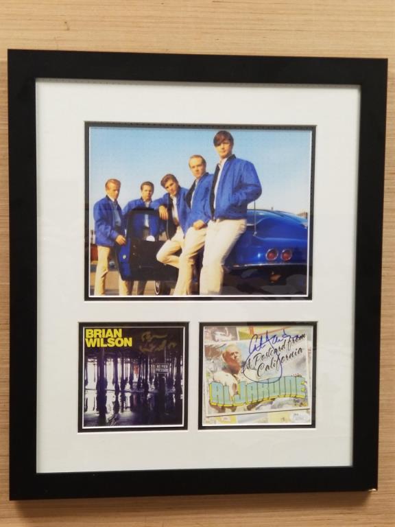 Framed Beach Boys photo & autographs: Brian Wilson and Al Jardine autographs framed with a Beach Boys photo. Authenticated by James Spence Authentication. Frame measures 20 inches high x 17 inches wide. Corner of frame is scuffed