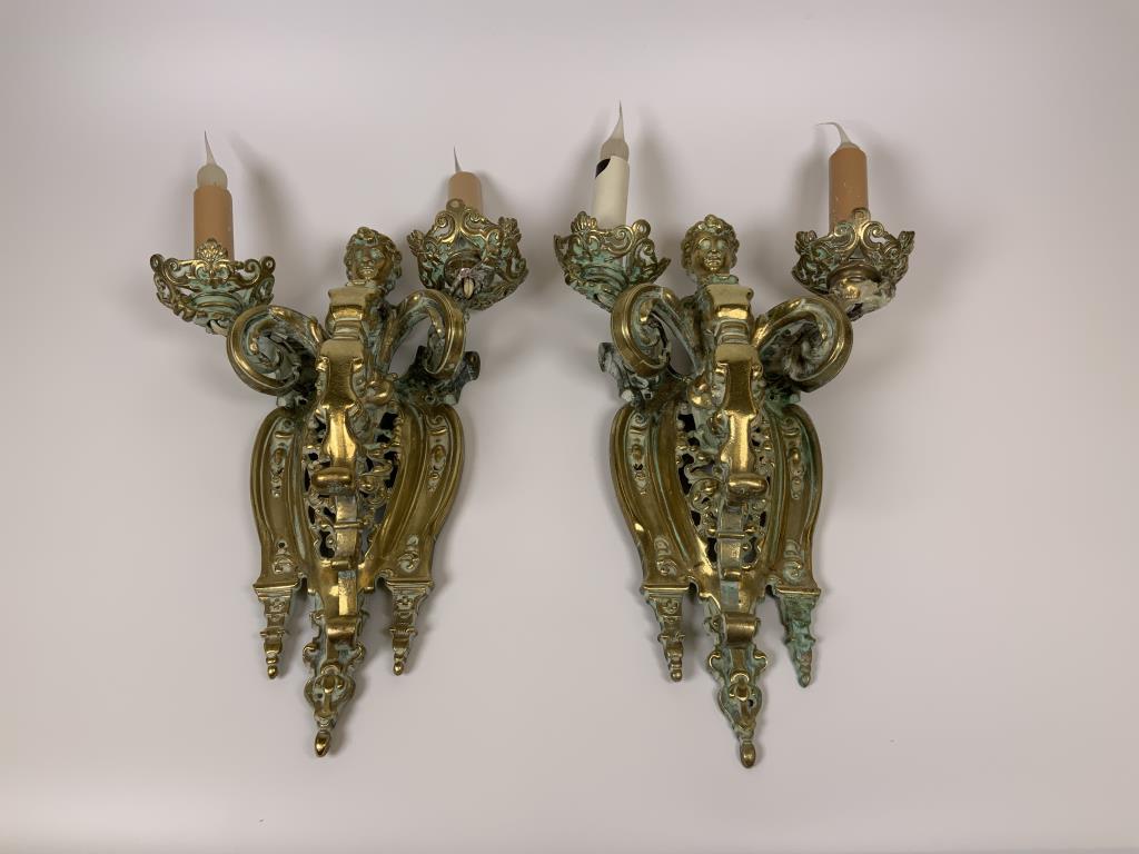 Pair 19th Century bronze wall sconces: Two light sconces, figure of woman’s head and bust, 12 inches long x 9 inches wide x 3 inches deep, electrified, chords are cut, candle part is new, some damage visible, see photos