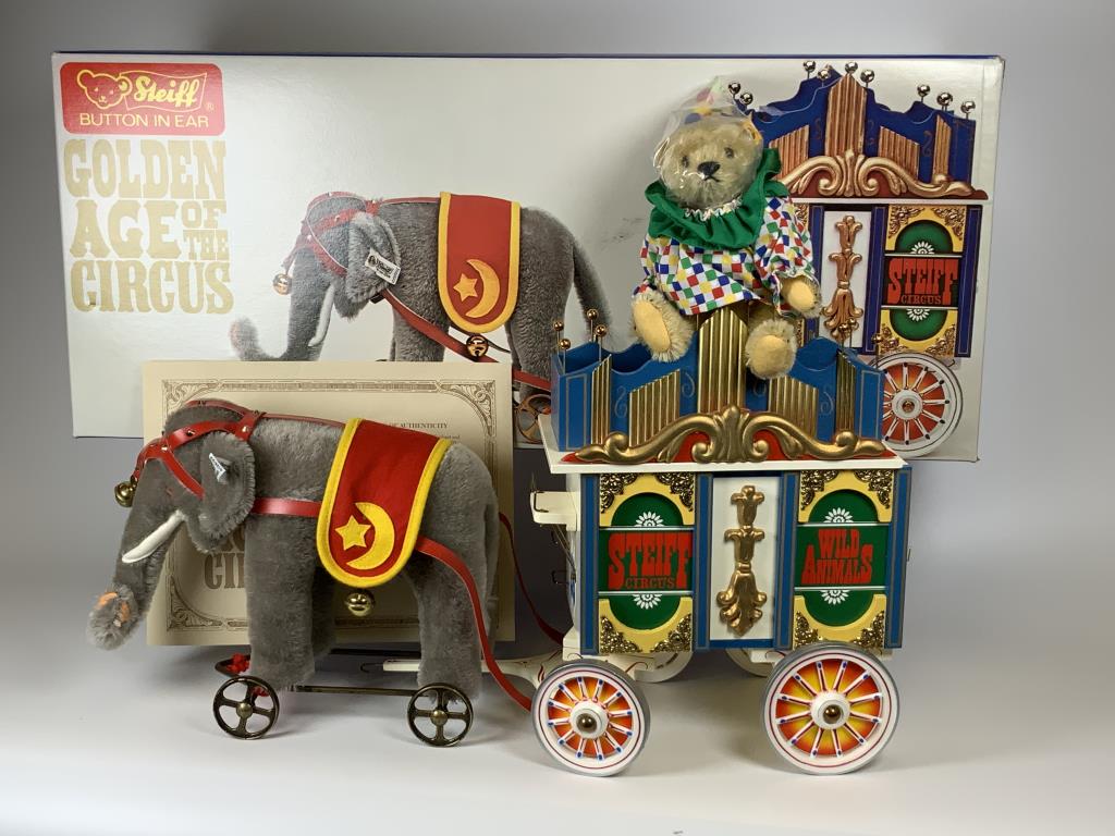 Steiff Golden Age of The Circus w/ C. .A.: Steiff Golden Age of the Circus elephant and calliope wagon with certificate of authenticity, elephant is 9 inches tall, 10.75 inches long, has button tag in ear, tag reads 0135/22, circus car / calli