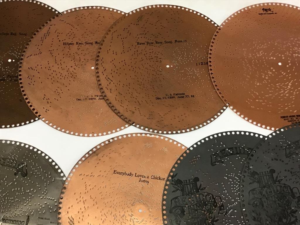 26 Regina 15.5 inch music box discs: 26 Regina music box discs, including Dixies land, Love Me Tender, Row, Row, Row song, Everybody Loves a Chicken, That College Rag and others, some have minor rust.