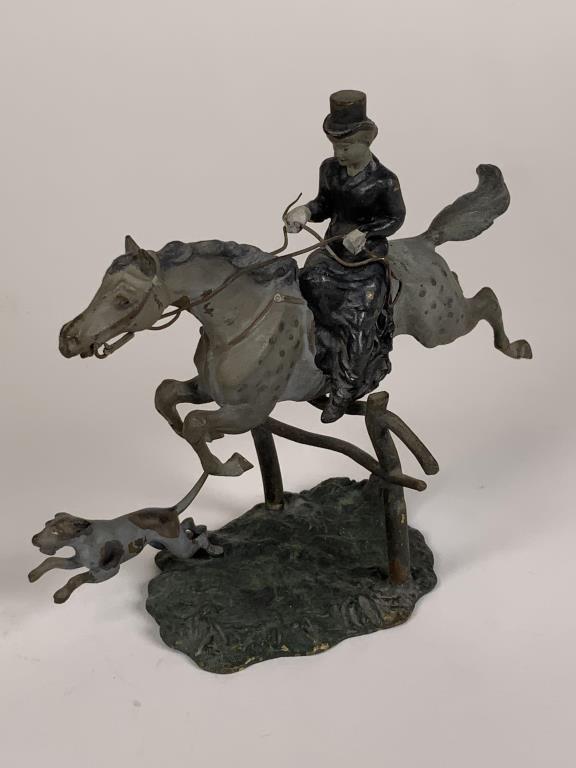 Austria Cold painted bronze sculpture side saddle: side saddle female rider on horse in full gallop with dog, 4.5 inches tall, 5.25 inches wide. A few specks of paint loss.