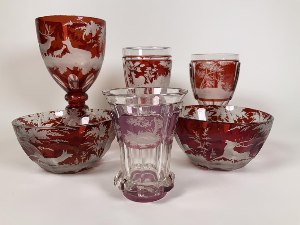 Ruby Cut to Clear Stag lot six pieces total, goblets: six pieces total, goblets and bowls, goblets are 6 - 8 inches tall, bowls are 2.5 inches tall, 4.75 inches wide. Also included is a four panel purple glass cup with a stag, sport dog, rabbit and horse