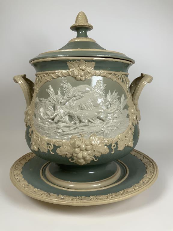 Large Mettlach Villeroy & Boch Soup Tureen Jasperware,: Jasperware, numbered 820, dog hunt scenes, has under dish. Highly decorative relief scenes. Tureen is 15 inches tall with lid, 14 inches wide with handles, plate is 14.25 inches, small chip on undersi