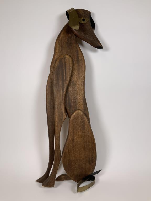 Mid Century Musketeers Inc.dog wall hanging wood and: wood and metal wall hanging stamped 1961 Musketeers on back, 26.25 inches tall, 7 inches wide.