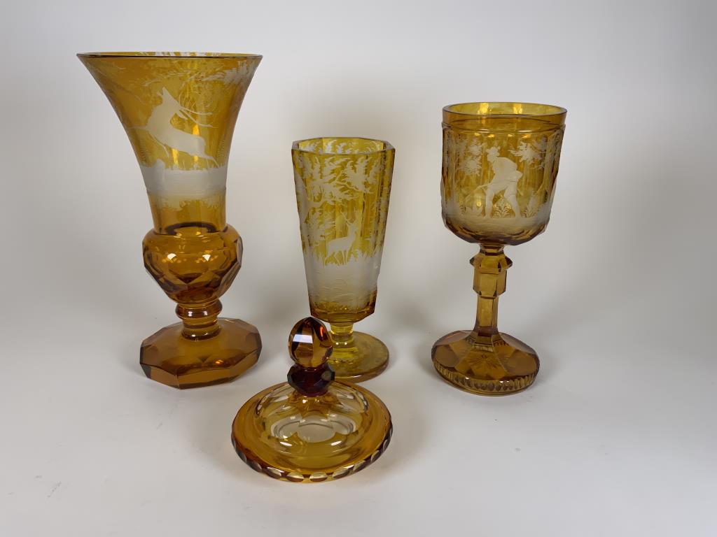 Amber Cut to Clear glass lot deer scene vase, 9.25: deer scene vase, 9.25 inches tall, stag and deer stemmed vase, 7 inches tall, a few small chips on top rim, a hunt scene stemmed goblet, 8 inches tall and a lid, lid fits on goblet but is not original