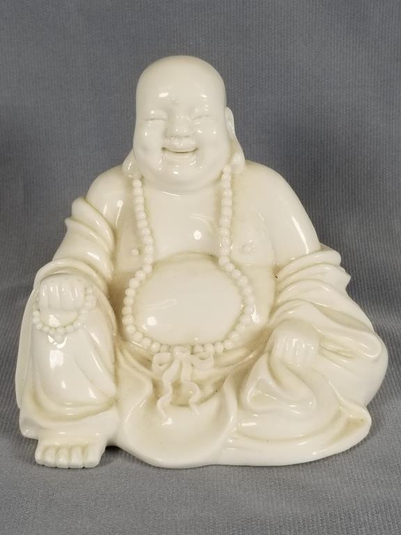 Blanc de chine seated laughing Buddha figure 3.5 inches: 3.5 inches tall x 4.5 inches long x 3.5 inches, Unsigned.