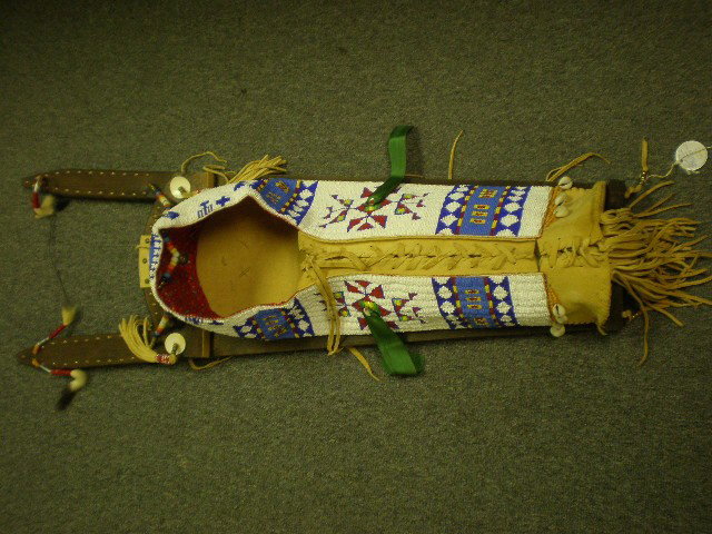 Fast Horse, artist from Oglula Sioux, So Dakota, 3: Fast Horse, artist from Oglula Sioux, So Dakota, 3' long & 1 foot at widest, cradle board with heavy bead decoration