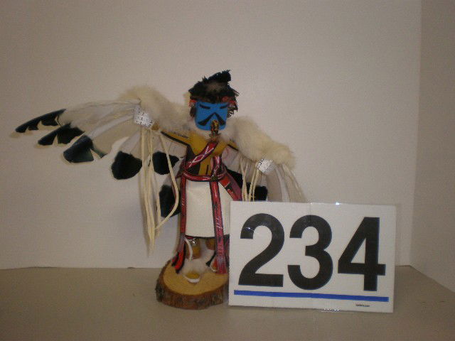 Spencer Navajo "Eagle Dancer" wooden doll. Decorat: Spencer Navajo "Eagle Dancer" wooden doll. Decorated with fabric, fur, feathers and paint, 12" H.