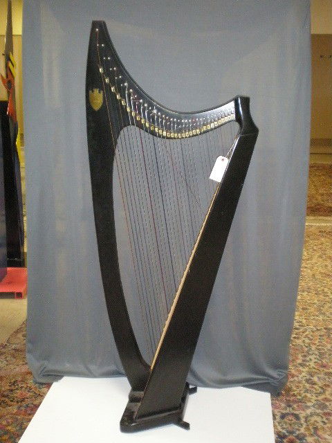 Harp. "The Troubadour Harp", Lyon & Healy, Inc., m: Harp. "The Troubadour Harp", Lyon & Healy, Inc., model 237I-C, ebony finish, 63.5"H x 26.5"W, 33 strings.