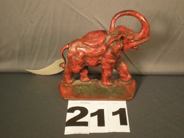 Cast Iron Doorstop: Cast iron red elephant doorstop 7 1/4" tall original red paint.