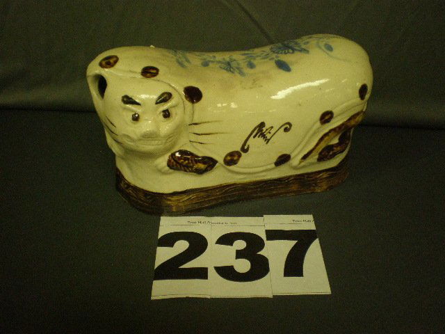 Chinese Ceramic Pillow: 10" long x 5 1/2" high x 4" deep Chinese ceramic pillow in the shape of a cat, designed to be used as a hot water bottle (note crack). Similar cat in the Forbes collection.
