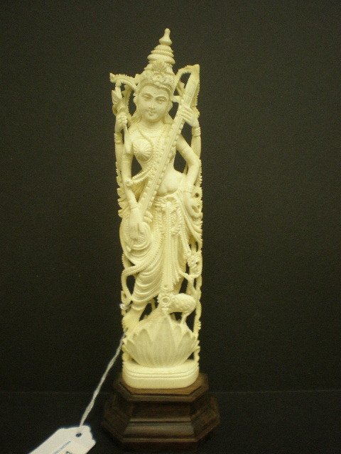Ivory Carving: 8" ivory carving of a Siam woman set on a 1 1/4" wood base.