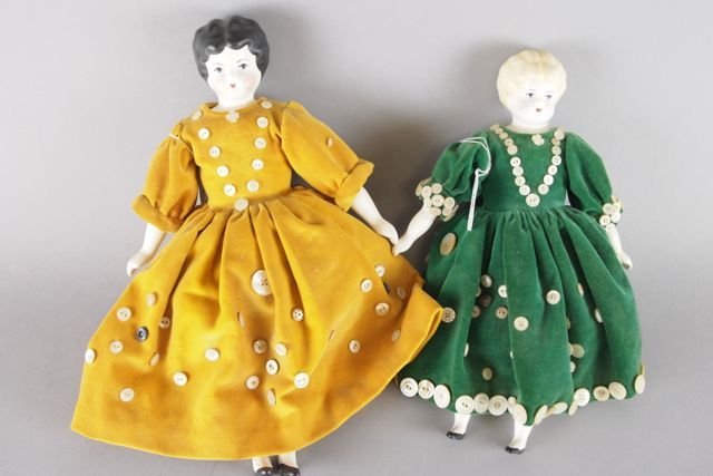 Three Dolls: 22" German antique blonde china head doll, on sawdust-filled kid body with bisque forearms (both arms very as is); 13" reproduction china head doll and an 11" reproduction china head doll.