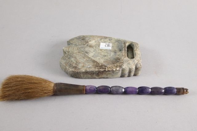 Ink Stone and Brush: Asian style carved cicada ink stone and calligraphy brush.