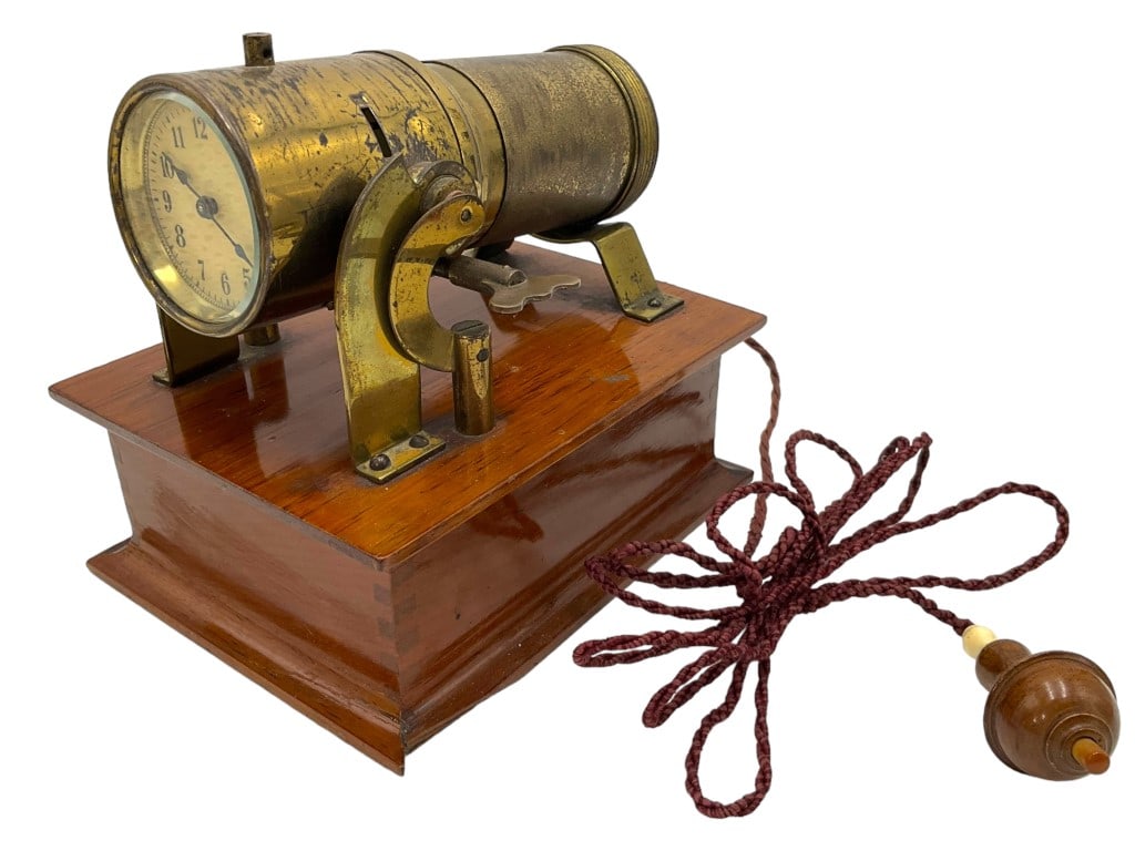 Antique Night Projection Clock: A Night Projection Clock. Circa 1910. It was designed to sit on a bedside table so you can read the time in the conventional manner or swivel the barrel to point to the ceiling or a wall,and in the da