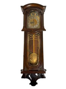 Large Art Nouveau Wall Clock: Beautiful Art Nouveau style wall hanging clock. Has a 3 train movement with a decorative brass dial depicting floral & butterflies. Unmarked dial. Includes 3 brass weights, pendulum and key.