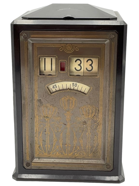 General Electric The Executive Clock: General Electric The Executive Clock. An electric clock with cloth cord in thermo plastic with painted metal face. Stands 5.75 inches tall and is 4 inches wide.