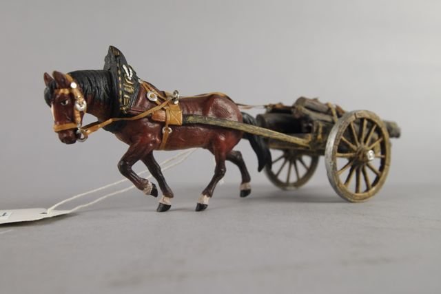 Vienna Bronze: 2.5"H x 7"L x 2"W, plow horse pulling a wagon of logs. Nice color.