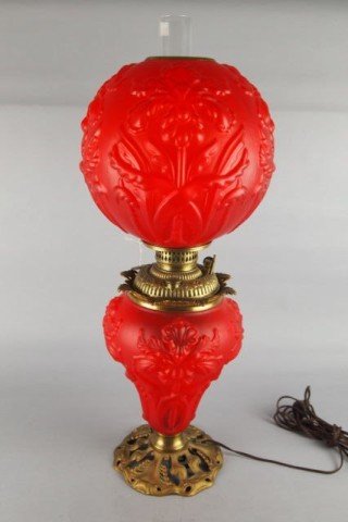 Gone With the Wind Lamp: 26" H red satin Gone With The Wind lamp, blown out Iris pattern , Art Nouveau brass base. Few minor chips on shade rim (typical of this type of lamp)