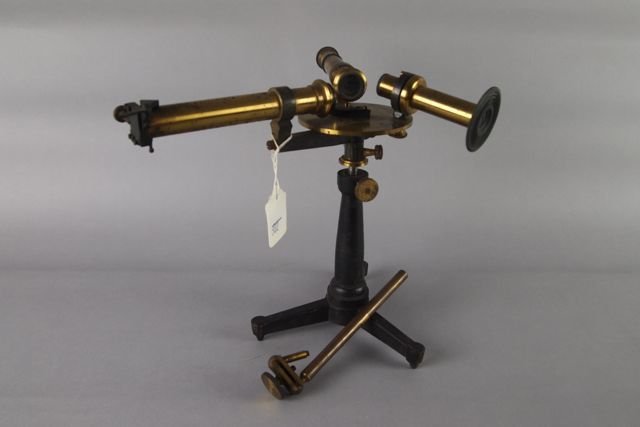 Triple Microscope: 9.5" H triple microscope on a three-footed iron base, signed James W. Queen & Co., Philadelphia. Missing a screw.