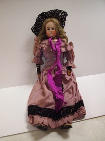Porcelain Doll: 27" porcelain doll, fixed eyes, closed mouth, cloth body with attached leather shoes, antique dress and bonnet.