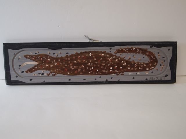Outsider Folk Art by Mose T (Tolliver): 5.5" x 23" paint on wood panel, brown spotted alligator, signed Mose T lower right.