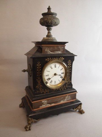 Victorian Mantle Clock: 18.5" tall x 11" wide x 7" deep Victorian mantle clock, metal case handpainted scenic decorated on four paw brass feet, urn finial, porcelain face key wind.