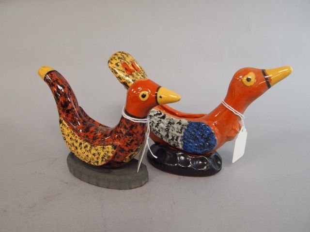 Two Redware Folk Art Pottery Birds: 4.25" x 7" redware folk art pottery bird, signed JCS (Seagreaves); other is4" x 5.5", signed JCS (Seagreaves); both are whistles.