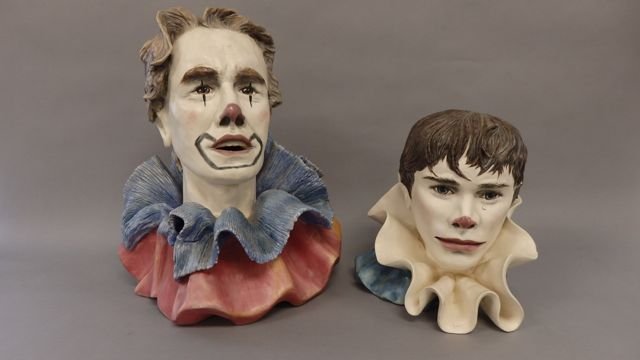 Lot of 2 Ceramic Clown Sculptures: 15.5"Tall x 12" Wide x 11" Deep, A Stonehedge Original Ceramic sculpture of an adult male clown, Signed and dated Russell Keich 1982. 2) Measures 10"T x 10"L x 8"D young male clown has a slight chip o