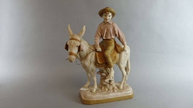 Royal Dux Figure: measures 14.75"T x 11" L porcelain figure of boy riding a donkey