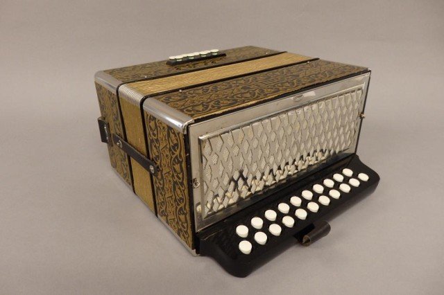 Horner Squeeze Box: Black w/overall gilt decoration of flowers squeeze box, overall condition good, some wear to bellows area & near 4 set buttons, straps are all present, comes w/carrying case