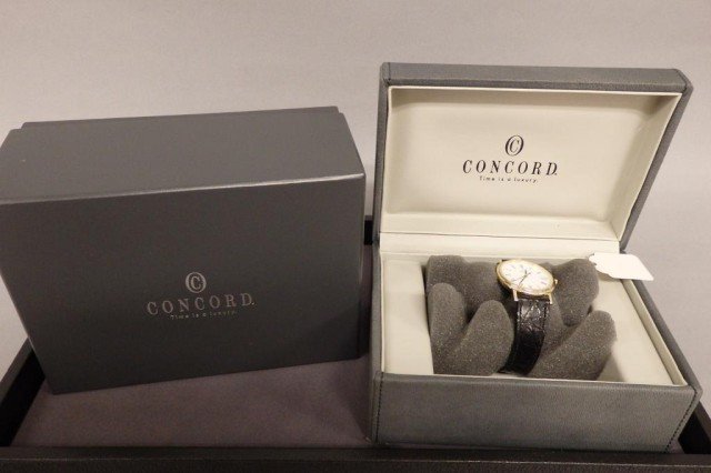 14k men's wrist watch: 14k yellow gold "Concord Luxury" men's wrist watch with calendar,barrery operated, watch back marked 6Jewels, Swiss V8, 255111, black leather strap,strap buckle not marked gold, original boxes