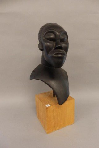 Composition Sculpture: Measures 16" x 10" Mounted on 6" x 7" x 6.5" solid wood plinth. Head and shoulders of a black man.