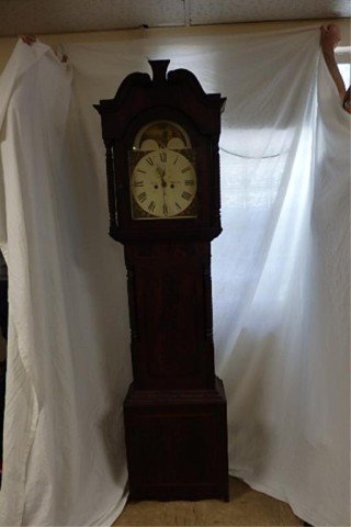 English Tall Case Clock: English tall case clock, 93" H x 22.5" W x 10.5" D. Handpainted floral face with second hand, two weights, time and chime, Oakes Oldham.Crotch mahogany case, with turned columns, inlaid, Brass eagle f