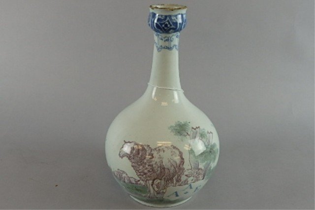 Early Tin Glaze Bottle: Measures 9.25" Tall Decorated with full body lamb. City building some as is to the bottle