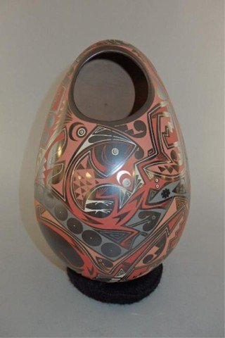 Pottery Egg Form Vase: 10" T X 6" at the widest point, egg shaped vase, overall decoration of fish, salamanders and geometric designs, signed Eli Navarette of Mata Ortiz (purchased at Tanner Chaney Gallery N.M).