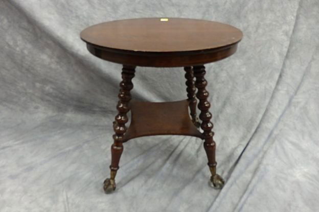 Oak Table: 28" diameter round oak table with glass ball and claw feet, top with some scratches on four heavily turned legs.