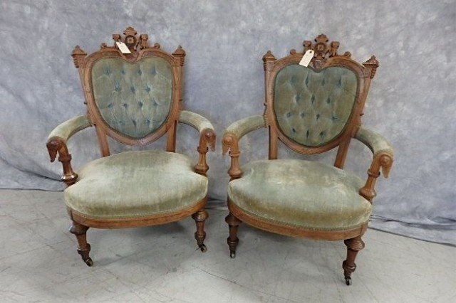 Two Victorian Chairs: 2 Victorian open arm chairs, tufted back, upholstered back, seat and arm rails, casters on front feet.