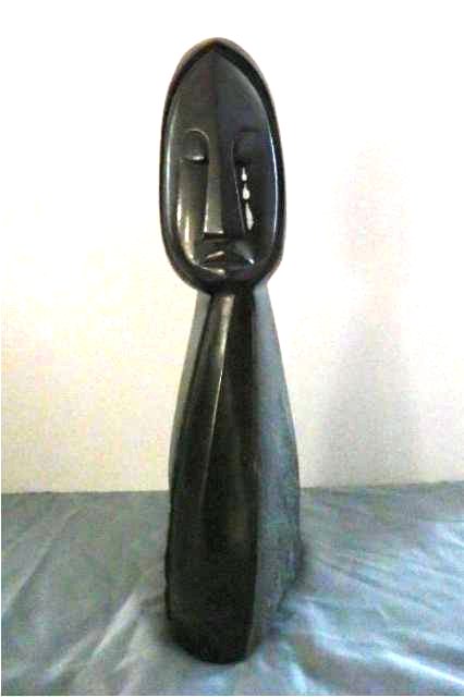Stone Carving: Hooded woman crying- Measures 21" T x 5.5" Lx 7." D, Weight approx. 30-40 lbs. Artist: Simba Title: Hooded Florida Teenager Medium: Spring Stone